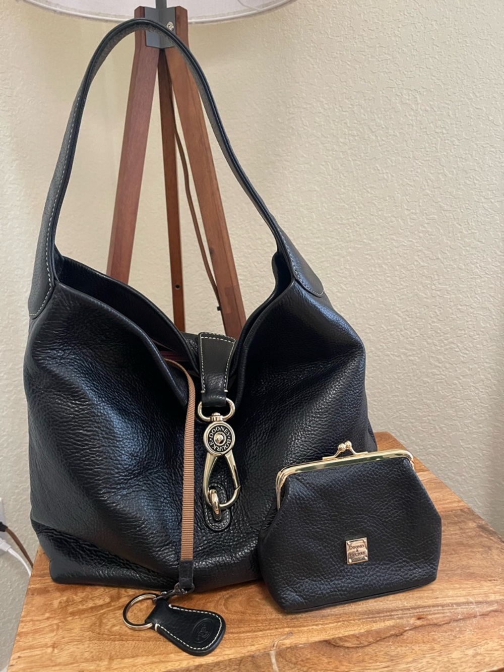 Dooney & Bourke black leather hobo bag with matching kiss lock coin purse